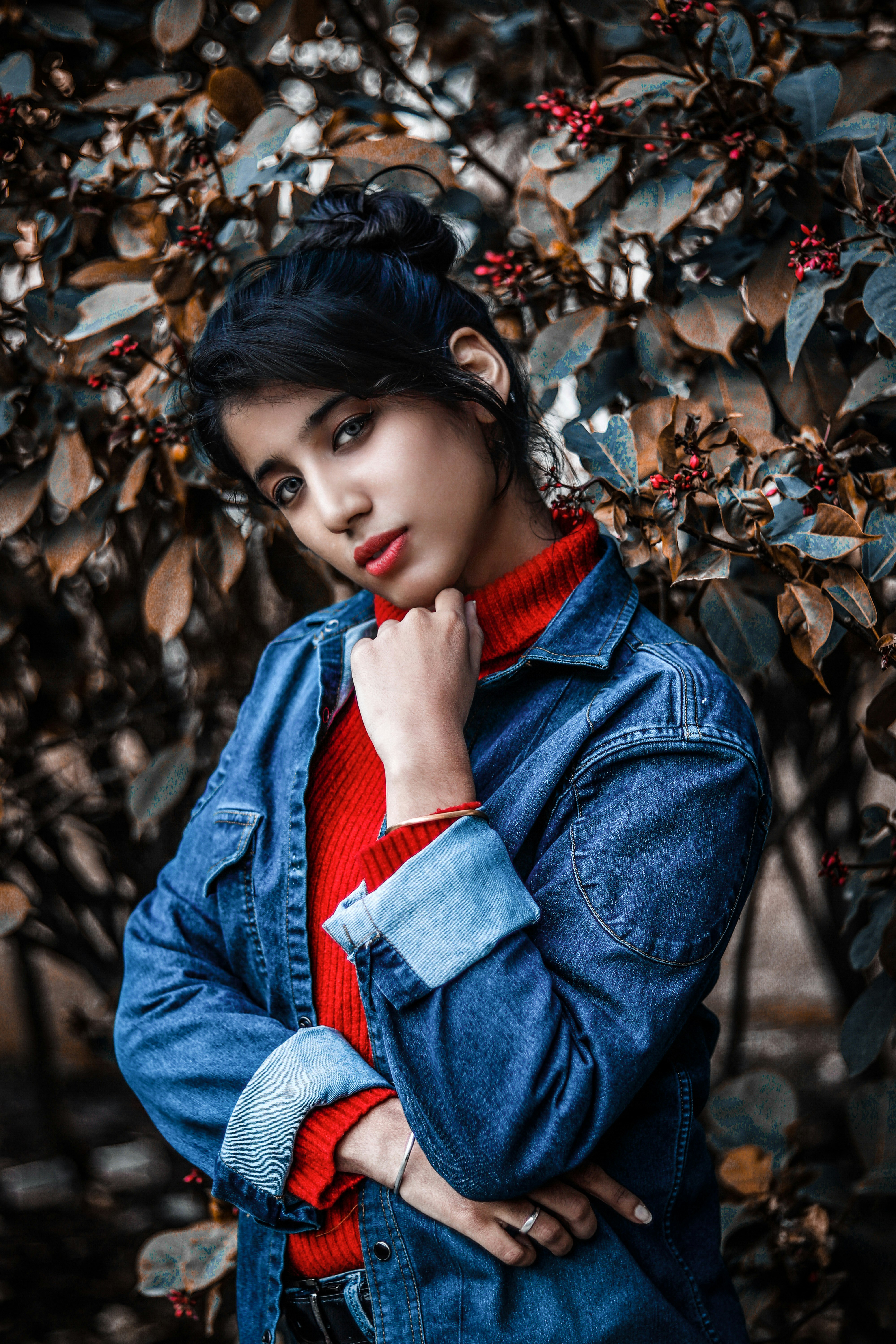 selective focus photography of woman wearing blue denim jacket